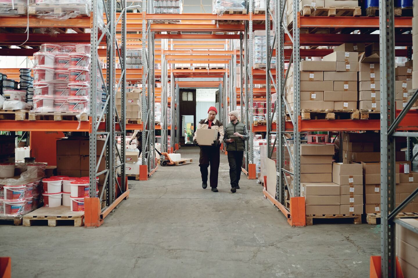 Operator moving a wrapped pallet
